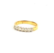 AN 18CT WHITE AND YELLOW GOLD 7 STONE DIAMOND RING with WGI certificate. (Approx diamonds 0.50ct)