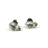 A VINTAGE PAIR OF WHITE METAL, AQUAMARINE AND DIAMOND EARRINGS Each set with an oval, cut aquamarine