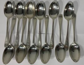 MAPPIN & WEBB, AN EDWARIAN SET OF TWELVE SILVER BEAD PATTERN TABLESPOONS Handles with lion holding a