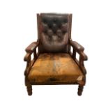 A 19TH CENTURY VICTORIAN MAHOGANY AND LEATHER LIBRARY ARMCHAIR With scrolling arms, raised on turned