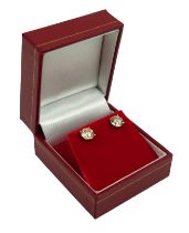 A PAIR 18CT WHITE GOLD VERY LIGHT BROWN NATURAL DIAMOND SOLITAIRE STUD EARRINGS. Boxed, with WGI