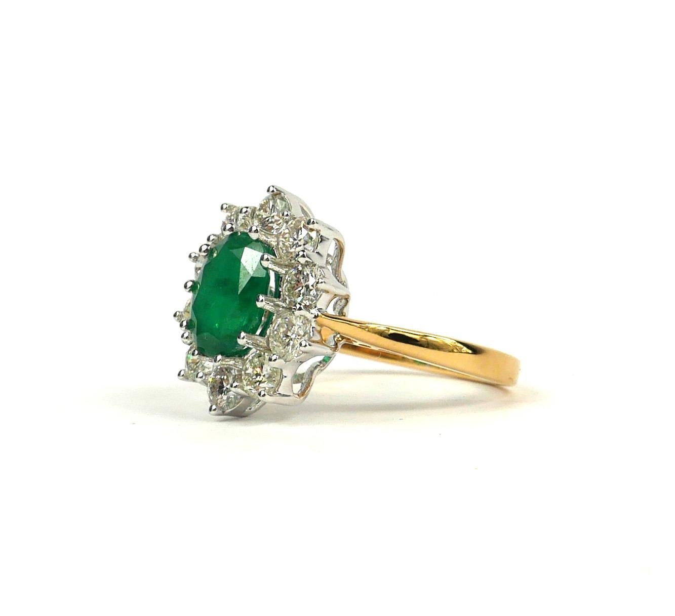 AN 18CT YELLOW GOLD OVAL EMERALD AND DIAMOND CLUSTER RING. (Approx Emerald 1.60ct, Diamonds 1.50ct) - Image 3 of 3