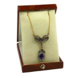 A BOW STYLE NECKLACE SET WITH AMETHYSTS AND DIAMONDS, Boxed.