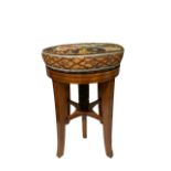 A 19TH CENTURY SATINWOOD AND LINE INLAID CIRCULAR UPHOLSTERED ADJUSTABLE PIANO STOOL. (h 50cm x