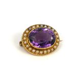 MURRLE BENNETT & CO., A VICTORIAN 15CT GOLD, LARGE OVAL CUT AMETHYST AND SEED PEARL BROOCH