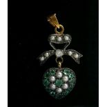 A HEART SHAPED PENDANT WITH BOW TOP SET WITH EMERALDS, DIAMONDS AND SEED PEARLS. Boxed.