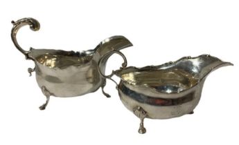 TWO SILVER SAUCE BOATS, BOTH RAISED UPON THREE SPADE FEET First assayed Cooper Brothers & Sons