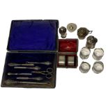 A COLLECTION OF SILVER TO INCLUDE PEPPERETTES, MUSTARD POT, NAPKIN RINGS ETC Makers include Henry