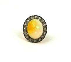 A 9CT YELLOW GOLD AND SILVER CABOCHON OPAL AND ROSE CUT DIAMOND RING. (Approx diamonds 0.40ct