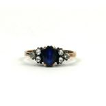 AN OVAL SAPPHIRE AND DIAMOND RING.