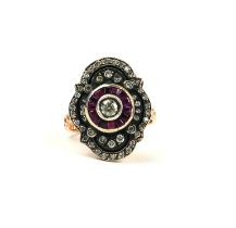 A VINTAGE STYLE 8CT ROSE GOLD (SILVER TOP) RING set with round diamonds and calibre cut rubies.