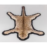 ARMY & NAVY NATURALISTS, LONDON, AN EARLY 20TH CENTURY TAXIDERMY INDIAN LEOPARD SKIN RUG. Taken by