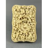 A FINE CANTON IVORY CARD CASE, C. 1860. Of barbed outline, carved to one face in very deep rich