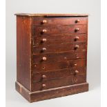 A LATE 19TH/EARLY 20TH CENTURY HARDWOOD COLLECTORS CHEST, WITH EIGHT NUMBERED GLAZED DRAWERS. (h