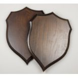 A PAIR OF ROWLAND WARD CARVED OAK REPLICA SHIELDS. Exceptional quality replicas of an original