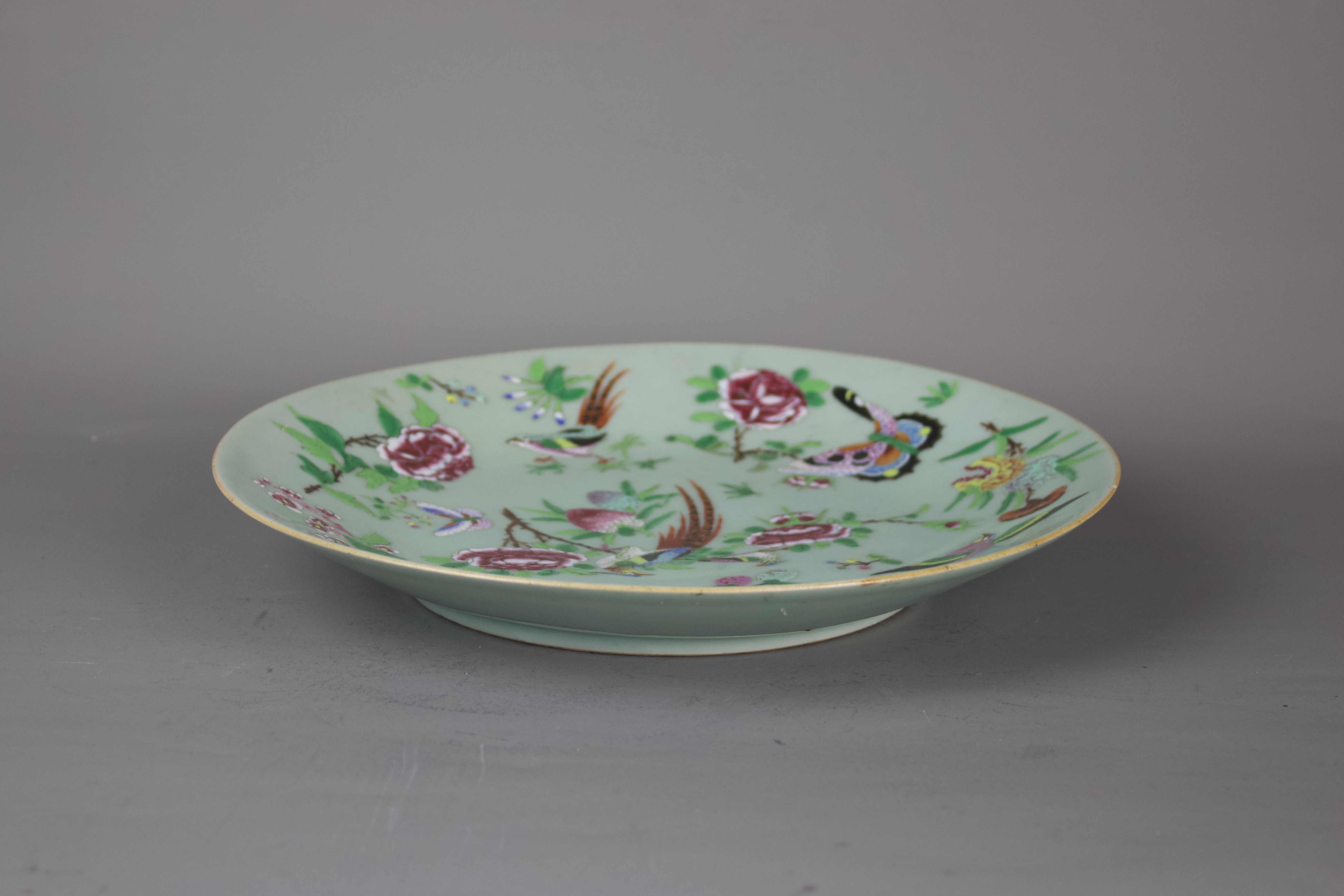 A Chinese famille rose porcelain plate, 19th century. H:26cm The plate is decorated with fruit, - Image 3 of 4