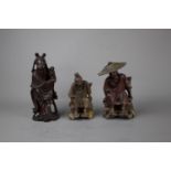 A group of wooden carved oriental figures, 19th / 20th century H: ' The taller figure is depicting