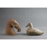 A pottery Horse's Head and a Duck, Han dynasty (BC 206 - AD 220) The horse H: 16cm, L16. 5cm, The