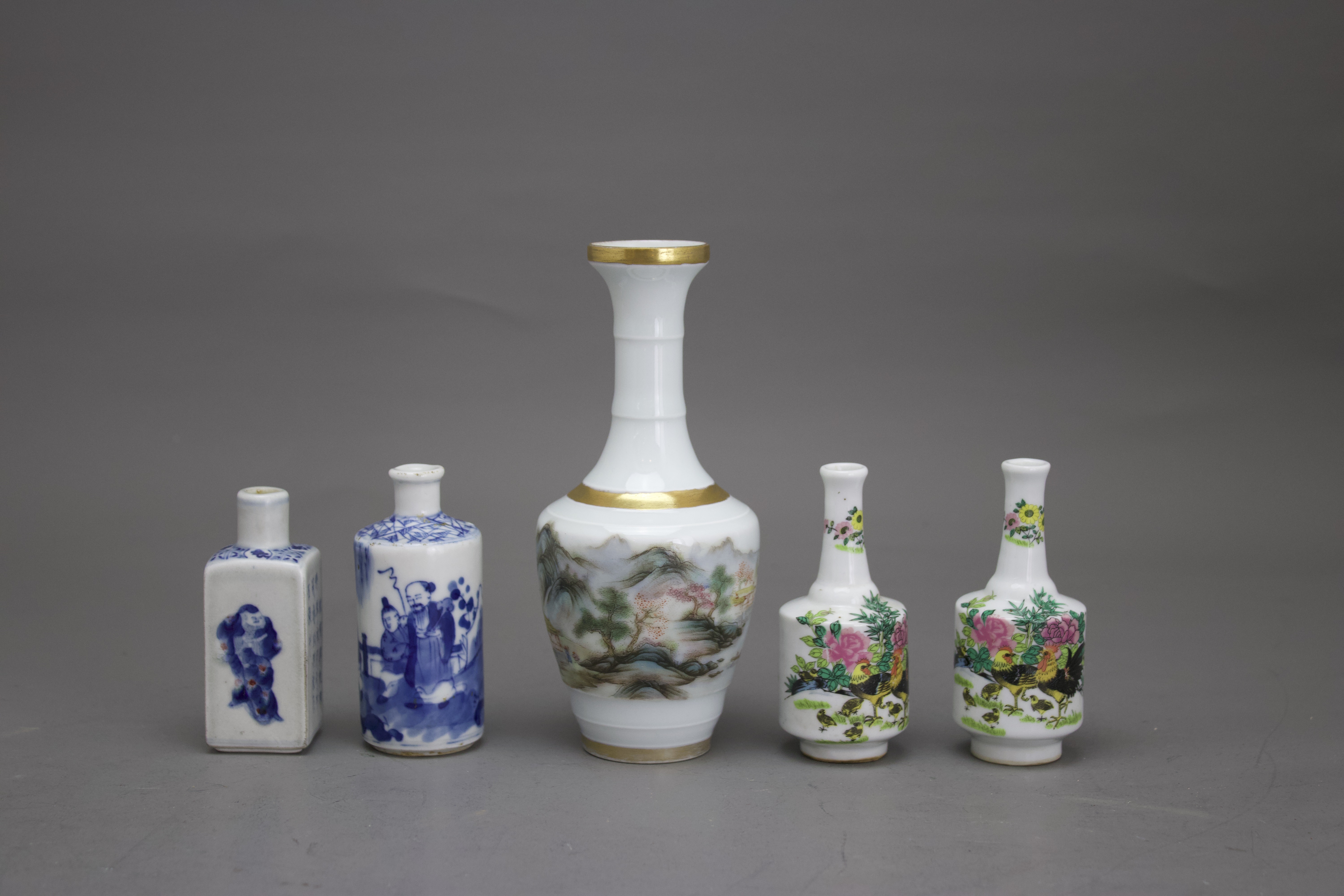 A group of five vases, 20th century H: 8.5 - 16.5 cms Including three enamelled vases and two blue