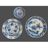 Three blue and white Dishes, 18th to 19th century the largest W: 23cm one with the ‘love chase’