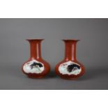 A pair of Chinese porcelain vases, c. 1950's. H: 17cm Two panels on coral background. One with lotus