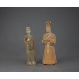 Two Pottery Figures,the taller an official in red pottery and the other in grey pottery, Six