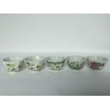 Five Chinese famille rose tea cups, 19-20th C. H: 4cm four are decorated floral, one bamboo. All are