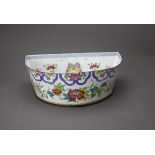 A large Canton Enamel Basin, Qianlong or later of half moon section with slightly flared sides,