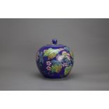 A blue ground 'famille rose' Jar and Cover, c. 1900 H: 19.5cm of globular form, decorated with gourd