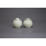 A rare small Pair of Qingbai Flasks and Covers,Song/Yuan dynastyH: 7.2cm, W: 6.5cm PROPERTY FROM THE