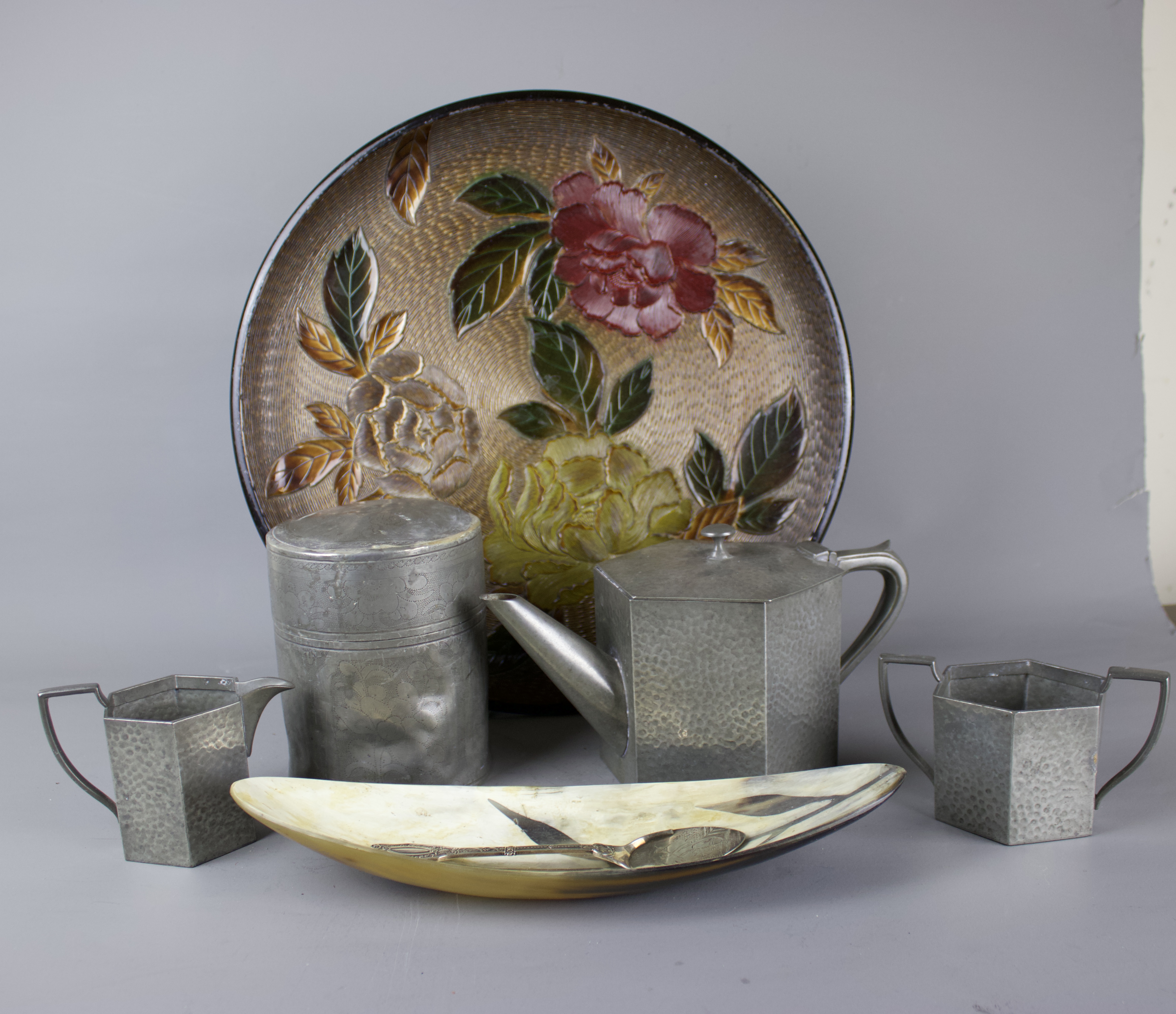 A tea ceremony set including an oriental tray, one Chinese pewter tea caddy, Art Deco pewter tea