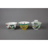 Three Chinese tea cups, 19th / 20th century. H: 9cm One is a traditional Chinese tea cup with