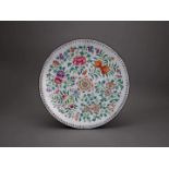 A Canton Enamel Dish, Qianlong W: 30cm with sprays of fruit and flowers radiating from a central