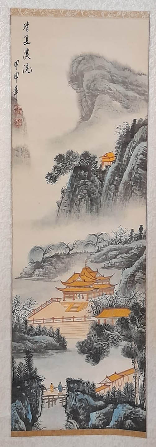 A 20th CENTURY CHINESE WATERCOLOUR LANDSCAPE SCROLL,having blue and white porcelain handles and