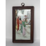 A porcelain plaque, 20th C. H:23.5cm Depicting a scholar and his student under a pine tree. The