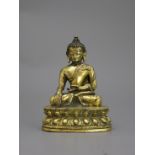A Gilt Bronze seated Buddha, 16th /17th centuryH: 9.6cm A Gilt Bronze seated Buddha, 16th /17th