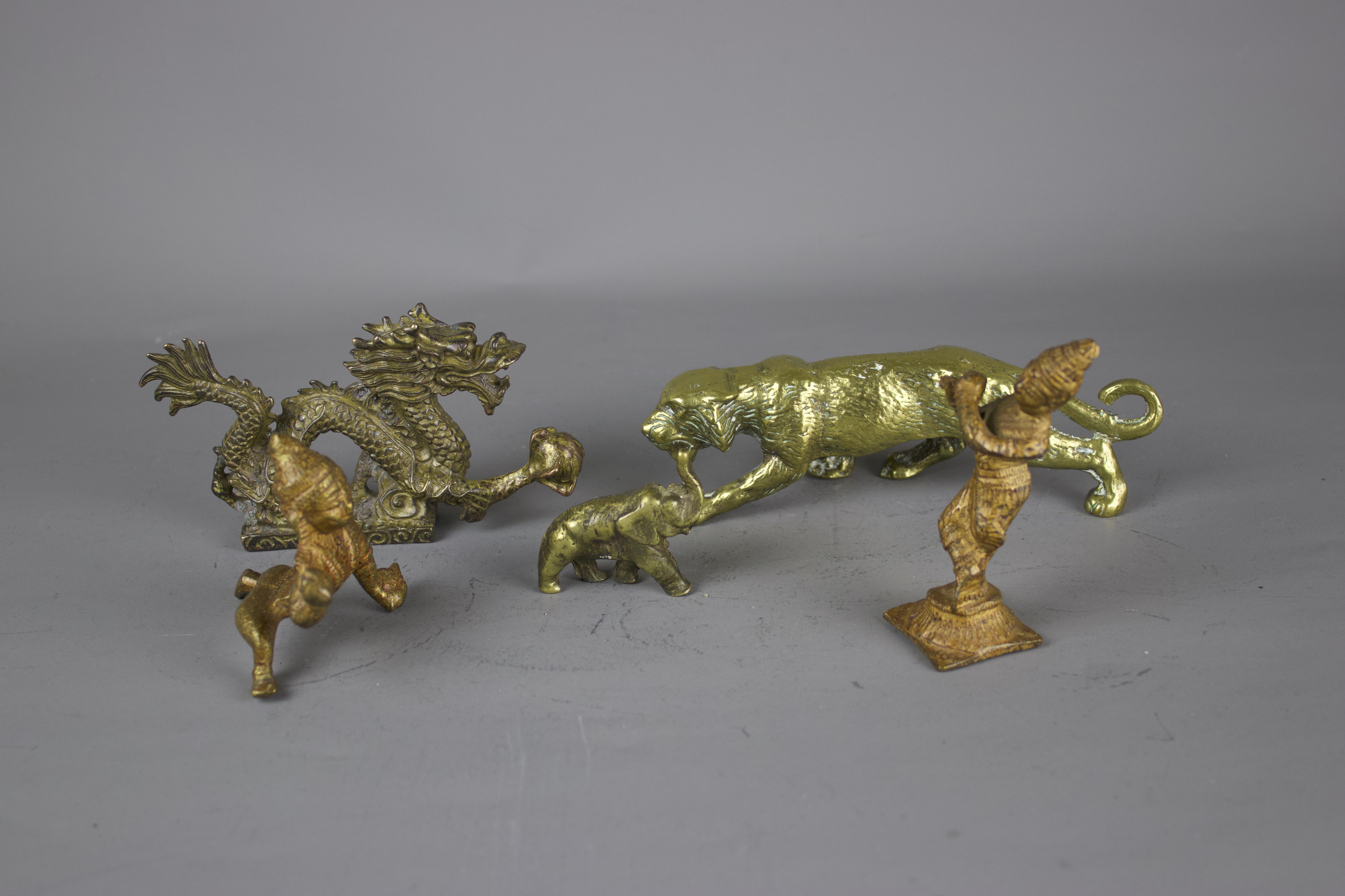 A group of metal figures, 19th / 20th century W: 15cm The heavy brass cast dragon on a plinth is