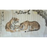 A LARGE 20TH CENTURY JAPANESE WATERCOLOUR ON PAPER Two recumbent tigers with foliage, bearing