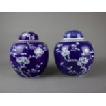 A pair of blue and white ginger jars, 19th/20th C. H: 21cm Both decorated in classic prunus on