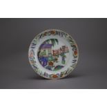 A 'famille verte' Plate, 18th Century W: 23.3cm Well decorated with a central scene of a young
