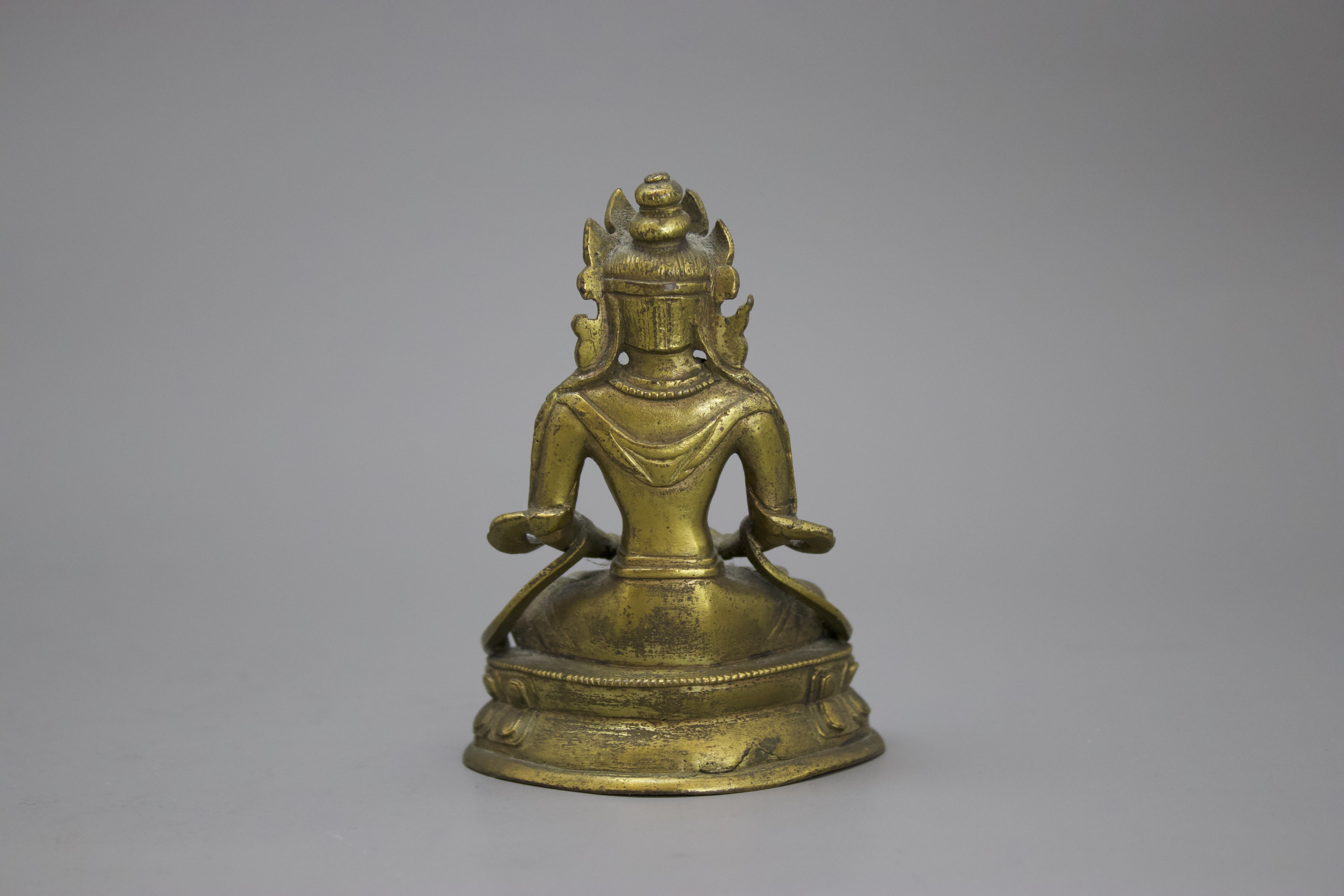 A Gilt Bronze Amitayus, c. 1800 H: 10cm well cast with some chased detail, seated on a waisted lotus - Image 2 of 6