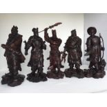 A set of Chinese mahogany carved figures, 20th C. H: 35cm This set of Army Generals figures of the