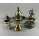 Eight metal lids, finials etc the largest W: 7.5cm mostly silver, with a wood stand