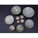 A small collection of celadon wares, comprising six bowls, a dish, a box and cover, and three