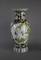 A big Chinese baluster shaped famille noir porcelain vase, 20th century. H:40cm A crane standing