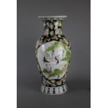 A big Chinese baluster shaped famille noir porcelain vase, 20th century. H:40cm A crane standing