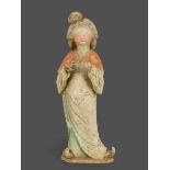 An attractive pottery Figure of a 'Fat Lady', Tang dynasty, AD 618 - 907 H: 55 cms PROPERTY FROM THE