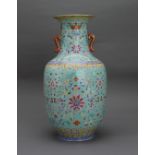 A turquoise ground lotus scroll Vase, Qianlong mark, Qing Dynasty H: 30cm FROM A PRIVATE
