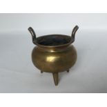 A heavy Chinese brass censer, 19th/20th C. H: 9.5cm A incised dragon flying in clouds across the