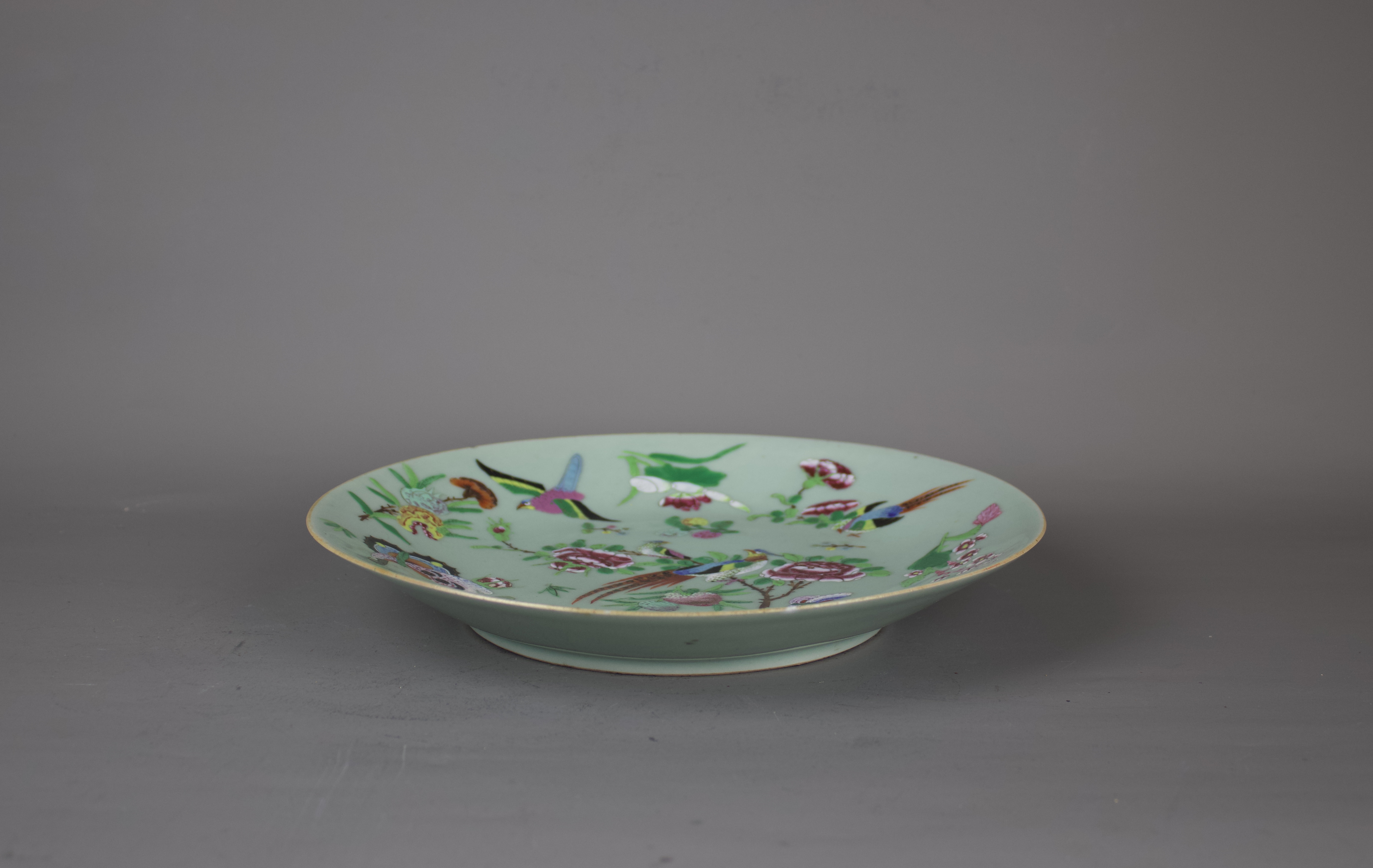 A Chinese famille rose porcelain plate, 19th century. H:26cm The plate is decorated with fruit, - Image 2 of 4